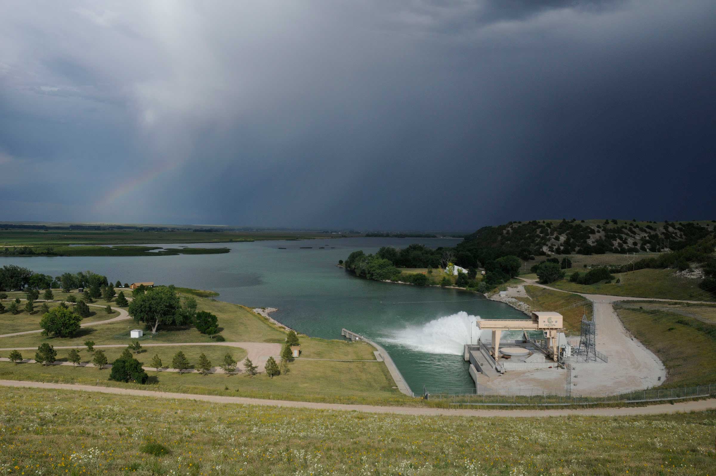 Lake Ogallala is created from released water behind Lake McConaughy and Kingsley Dam. During release, water sprays from the dam, creating a 'rooster tail' or an arc of water over the lake, that allows oxygen back into the stratified water. Lake Ogallala water stays relatively cold attracting fish and eagles.