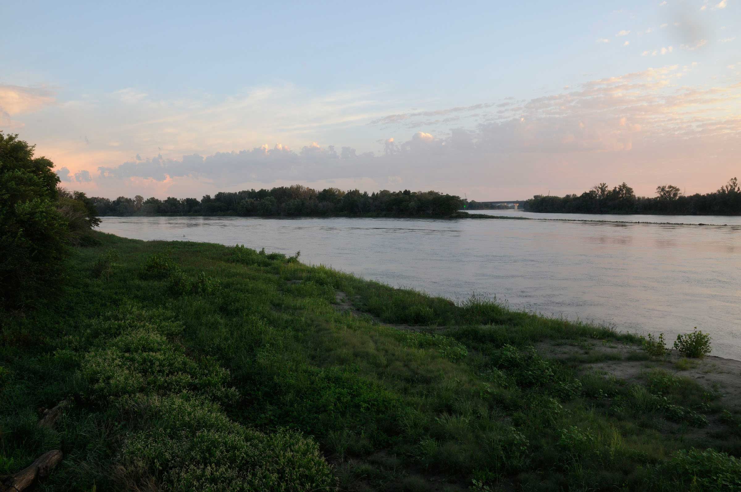 This camera is located at the confluence of the Platte and Missouri rivers at Schilling Wildlife Management Area near Plattsmouth, Nebraska, south of Omaha. After a 1352 river-mile journey and draining 90,000 square miles, the water here reaches the lowest point in the watershed and the eastern end of the Platte River Basin.